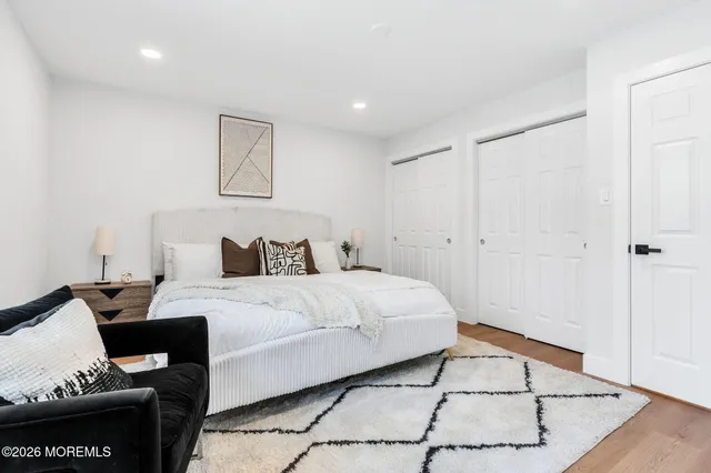 a bedroom with a bed and a table