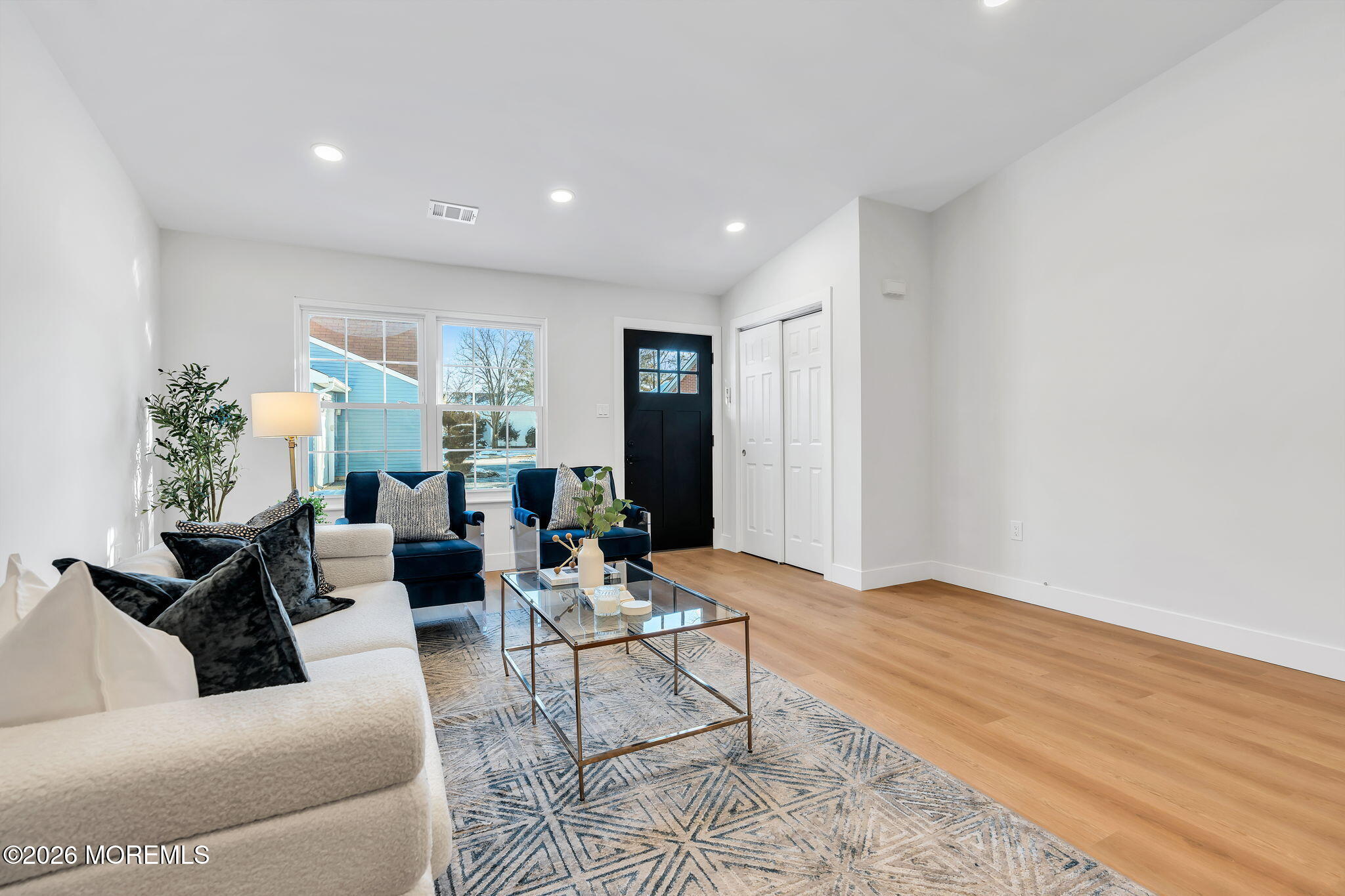 5 Jaffreyton Close Freehold, NJ 07728 - Photo 5 of 22 a living room with furniture and wooden floor