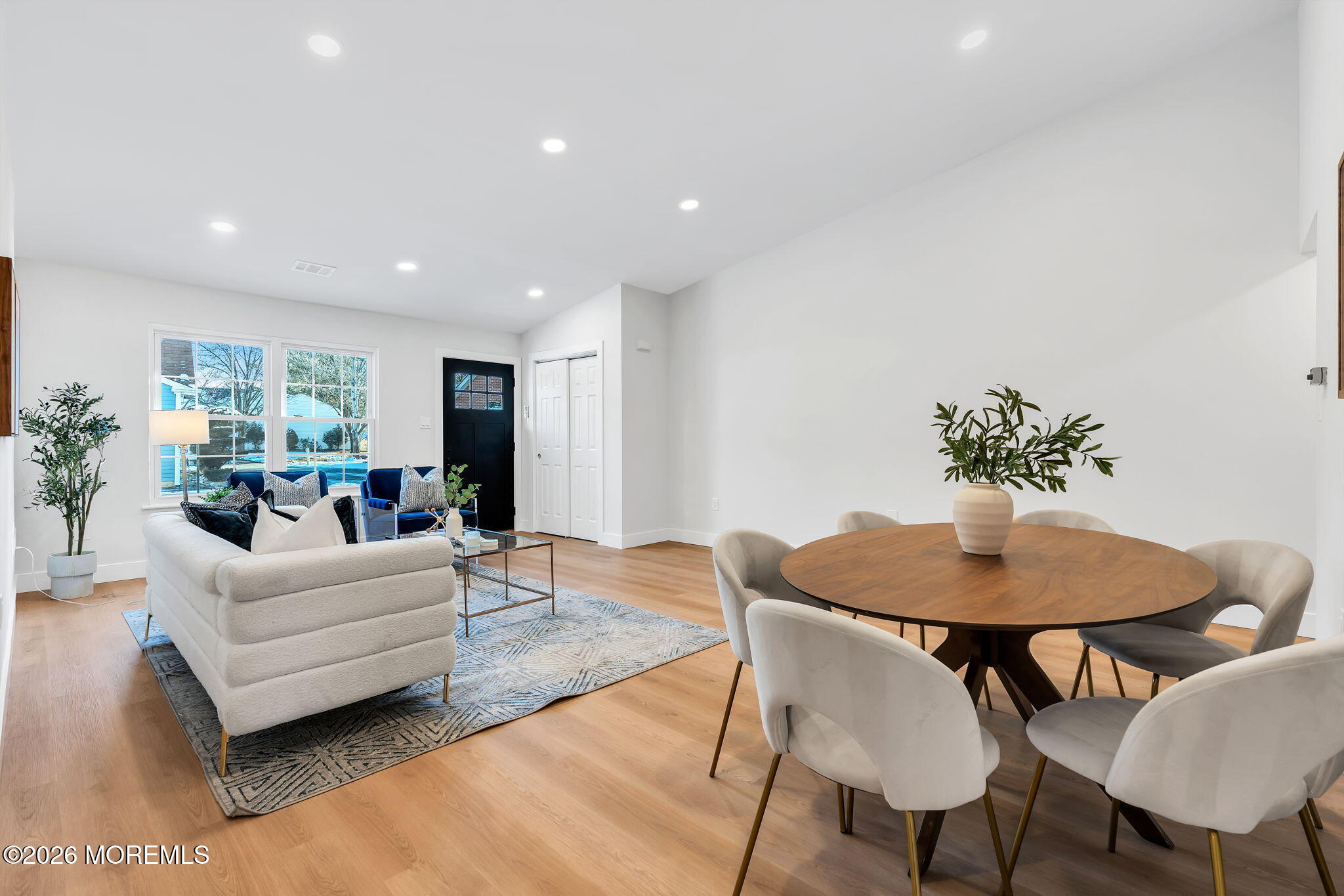 5 Jaffreyton Close Freehold, NJ 07728 - Photo 7 of 22 a living room with furniture potted plant and a table