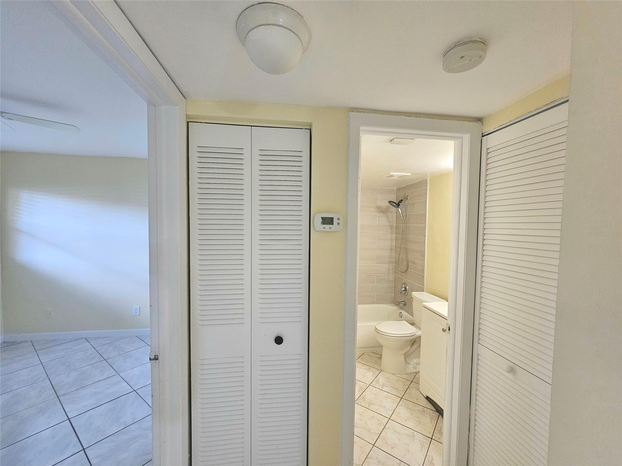 3396 Foxcroft Road, Unit 110 Miramar, FL 33025 - Photo 18 of 24 a bathroom with a shower and a sink