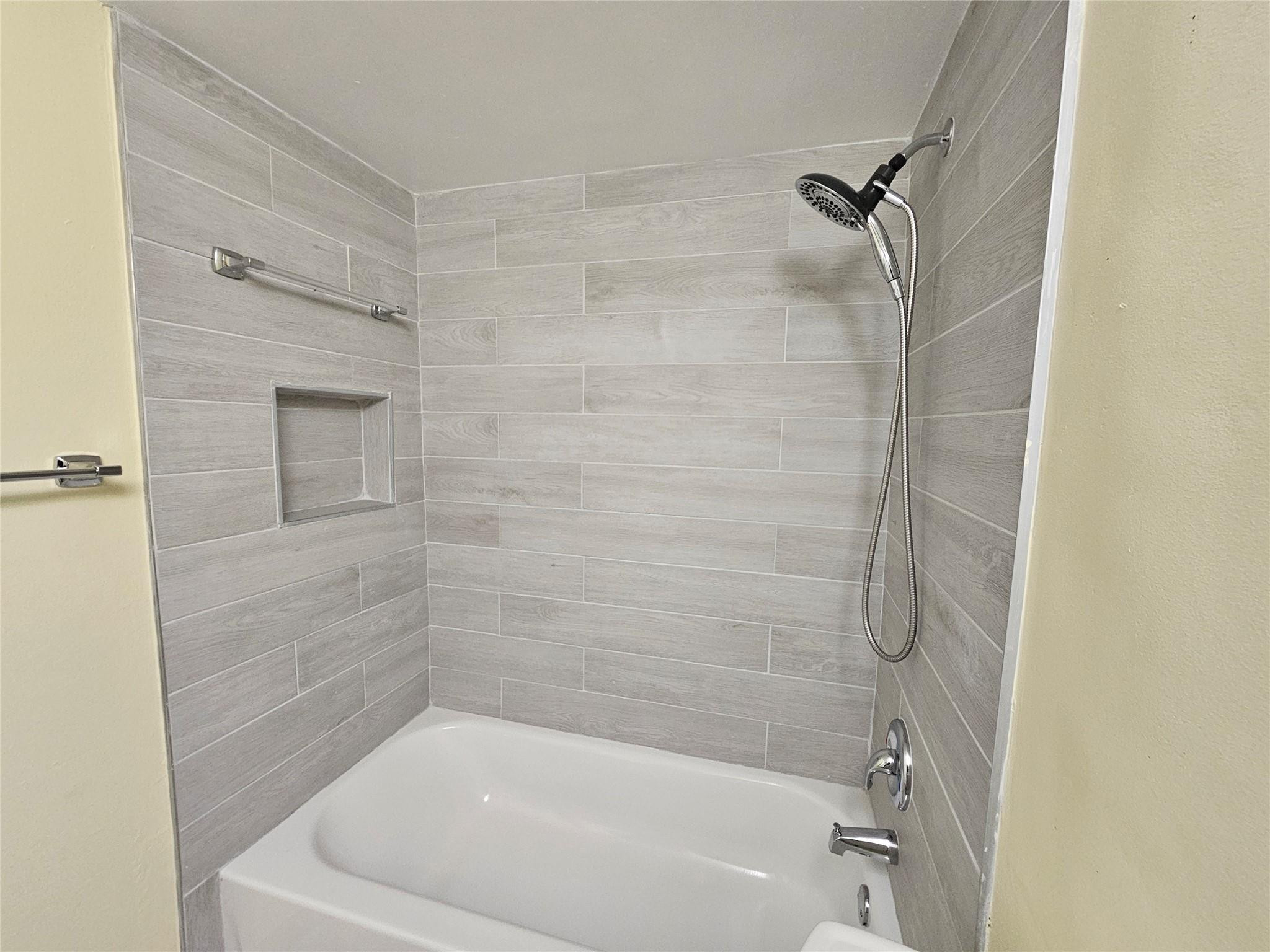 3396 Foxcroft Road, Unit 110 Miramar, FL 33025 - Photo 20 of 24 a bathroom with a bathtub