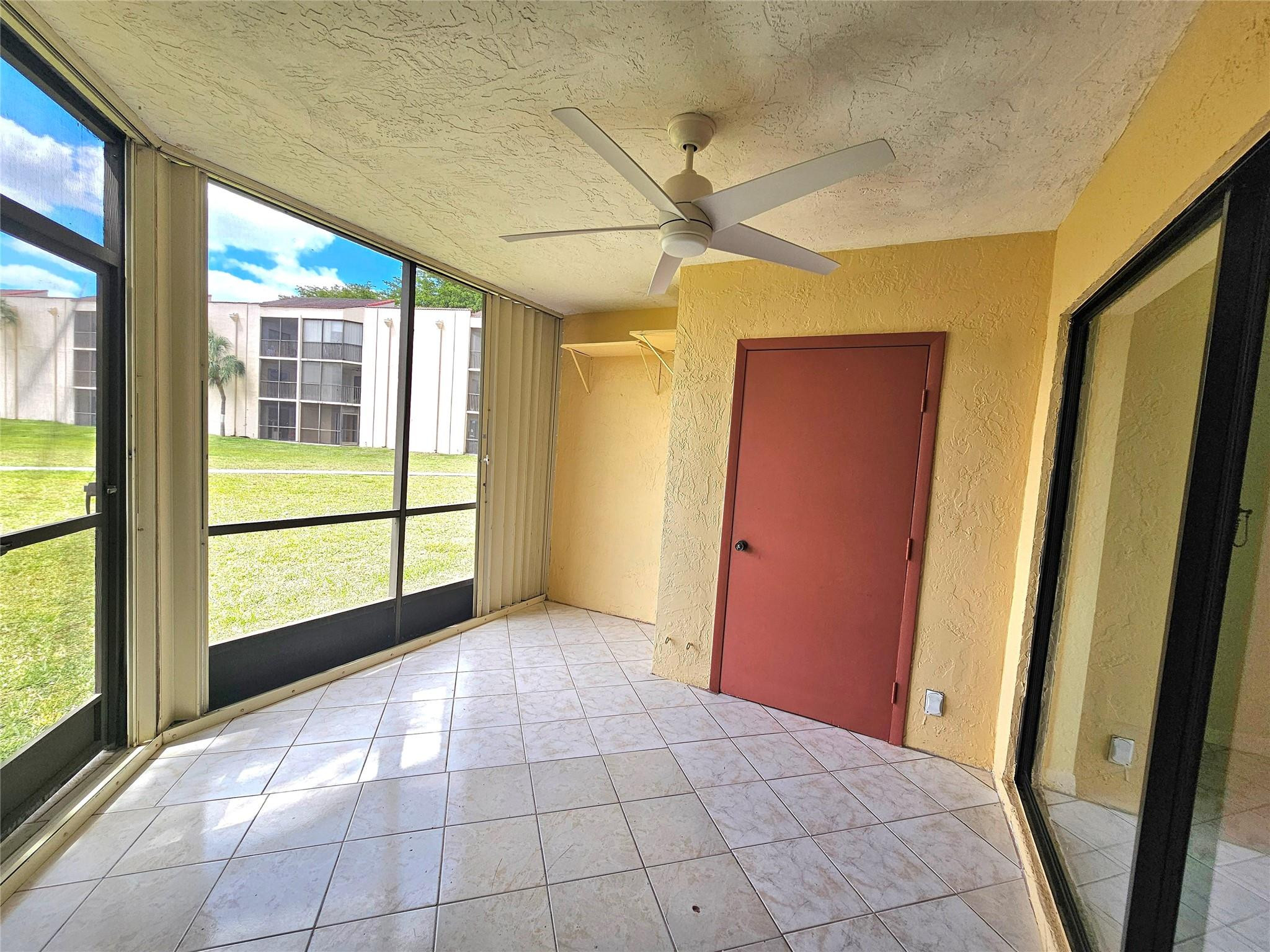 3396 Foxcroft Road, Unit 110 Miramar, FL 33025 - Photo 23 of 24 a view of an empty room and window