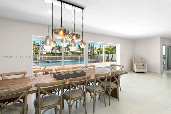 a view of a dining room with furniture window and outside view