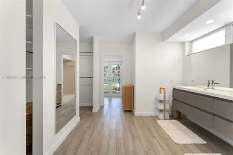 a bathroom with a sink and mirror