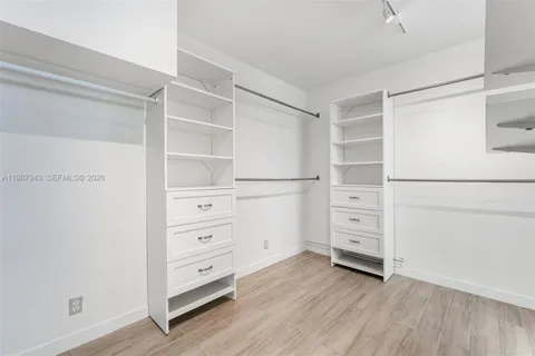 a view of an empty walk in closet