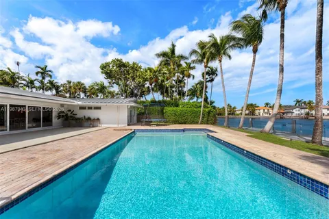 a view of a swimming pool with a lake view
