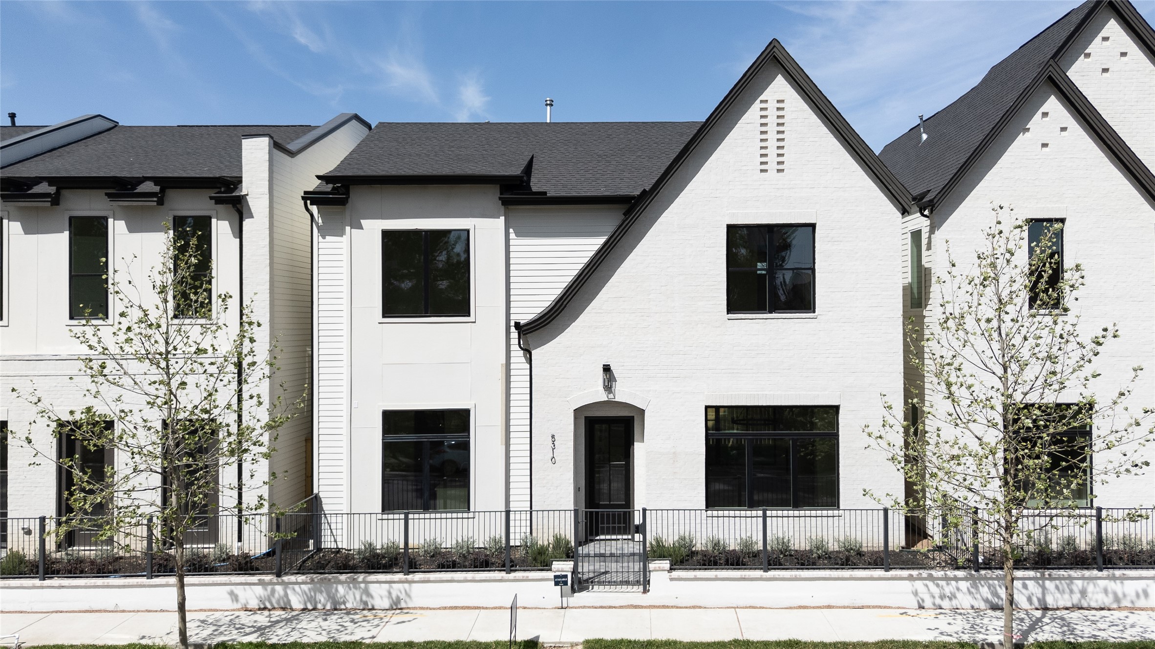5309 Lambeth Riverside Drive Houston, TX 77091 - Photo 2 of 31 Exceptional Curb Appeal - This home comes with a well-proportioned handsome elevation. Elegant combination of hand slurred brick, painted carriage style garage door with a terracotta paver driveway.