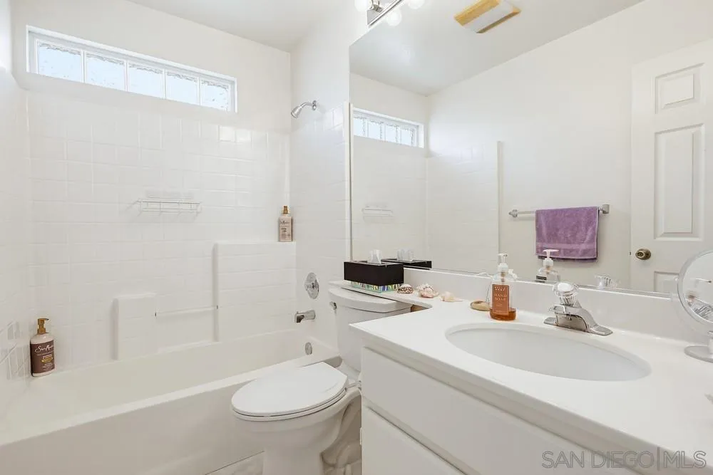 2501 Columbine Road Alpine, CA 91901 - Photo 23 of 44 a bathroom with a sink toilet vanity and shower