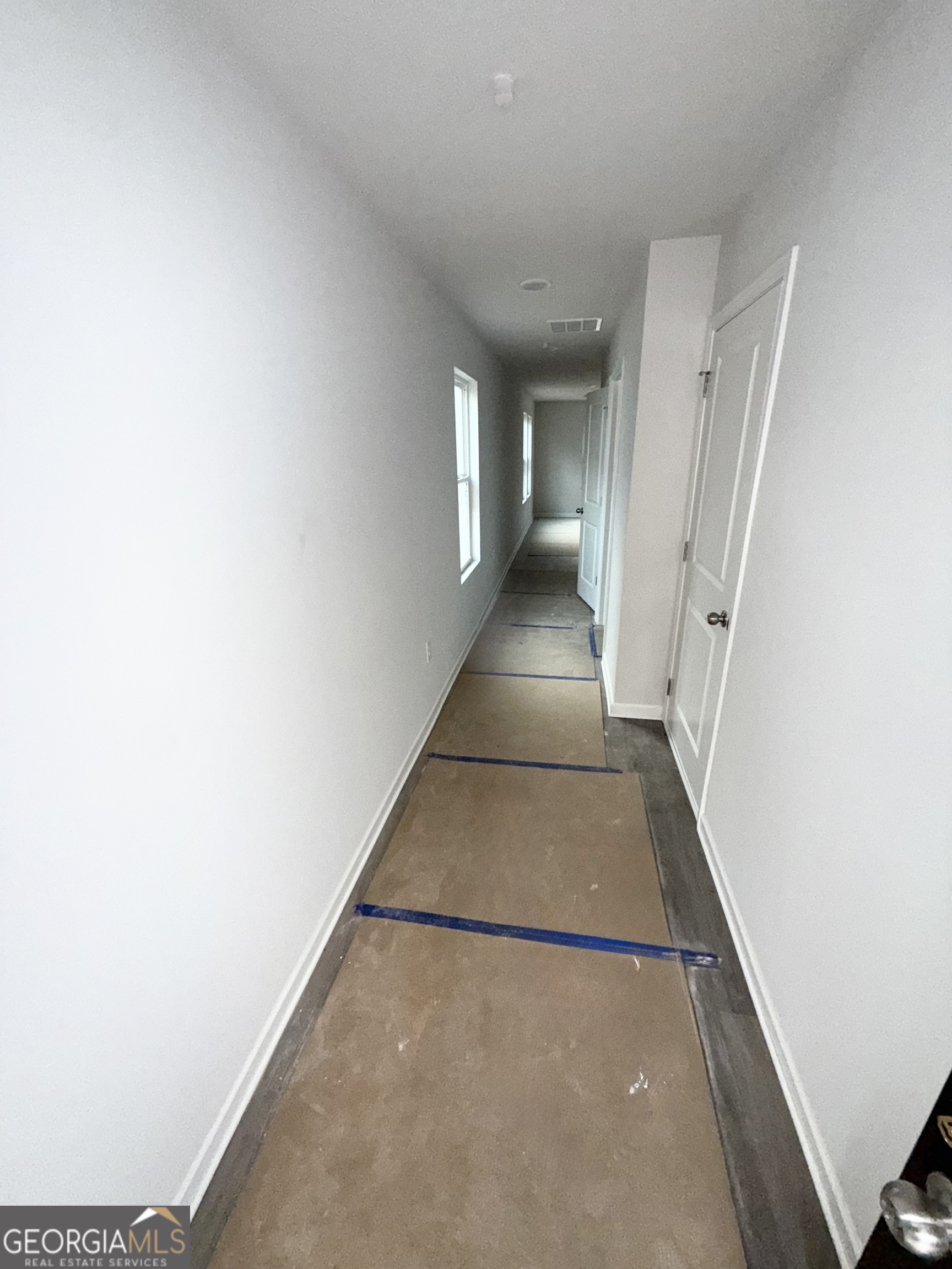 11604 East Lovejoy Road Hampton, GA 30228 - Photo 4 of 22 a view of a hallway with staircase
