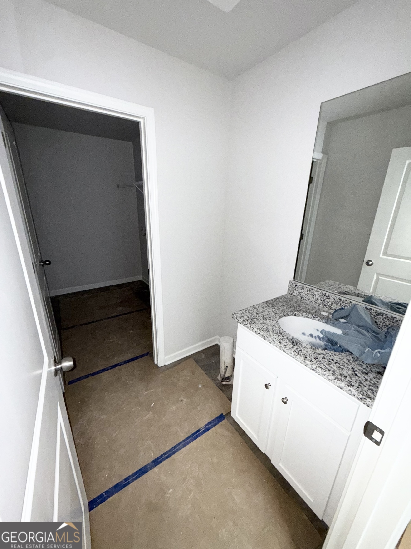 11604 East Lovejoy Road Hampton, GA 30228 - Photo 6 of 22 a bathroom with a granite countertop sink and a mirror