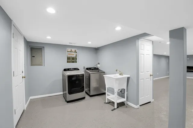a view of a livingroom with furniture and windows