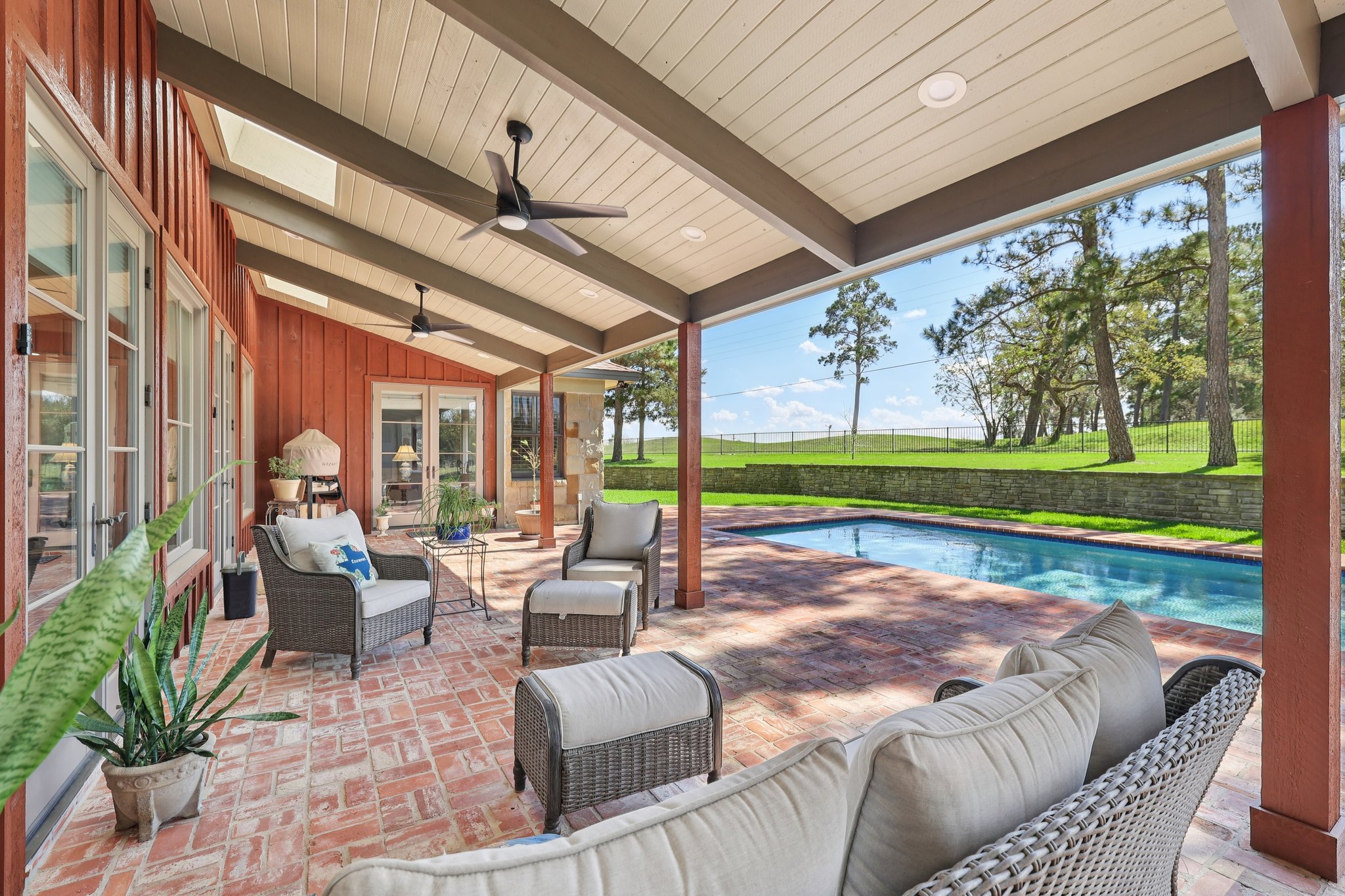 546 McAllister Road Bastrop, TX 78602 - Photo 20 of 40 Fenced backyard with outdoor seating, a patio, an outdoor pool, and ceiling fan