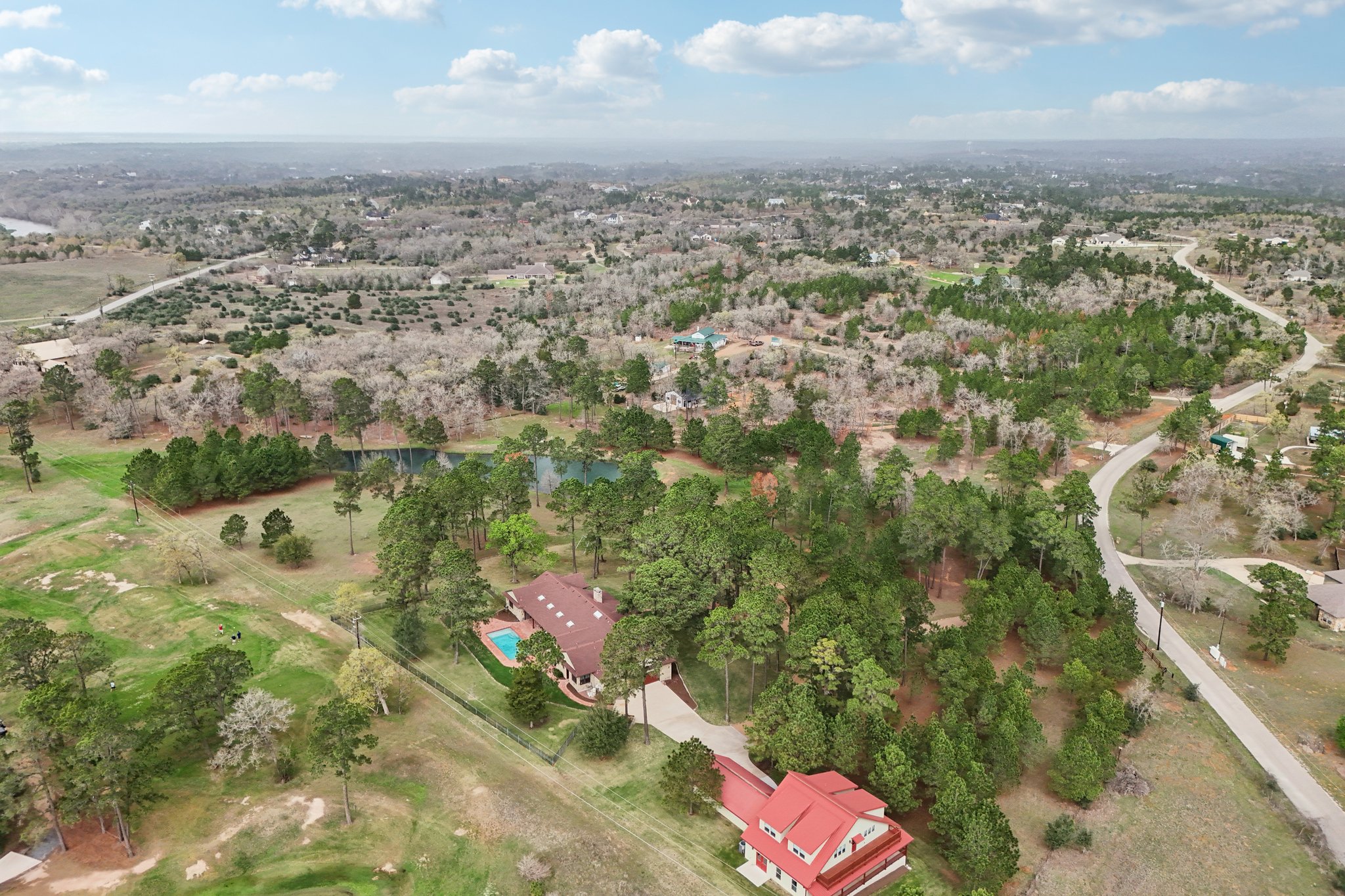 546 McAllister Road Bastrop, TX 78602 - Photo 26 of 40 an aerial view of residential houses with outdoor space
