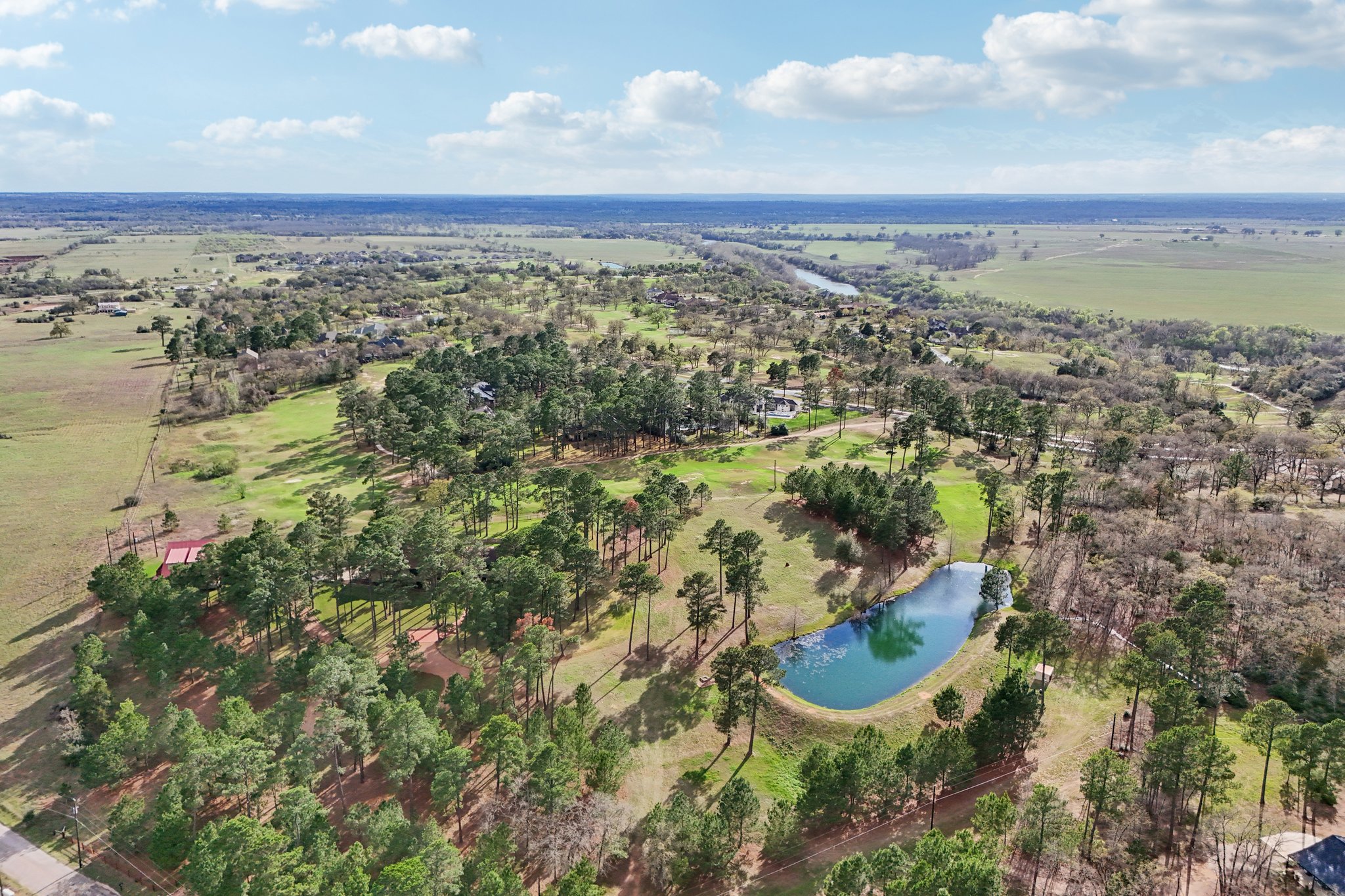 546 McAllister Road Bastrop, TX 78602 - Photo 8 of 40 an aerial view of residential building and lake