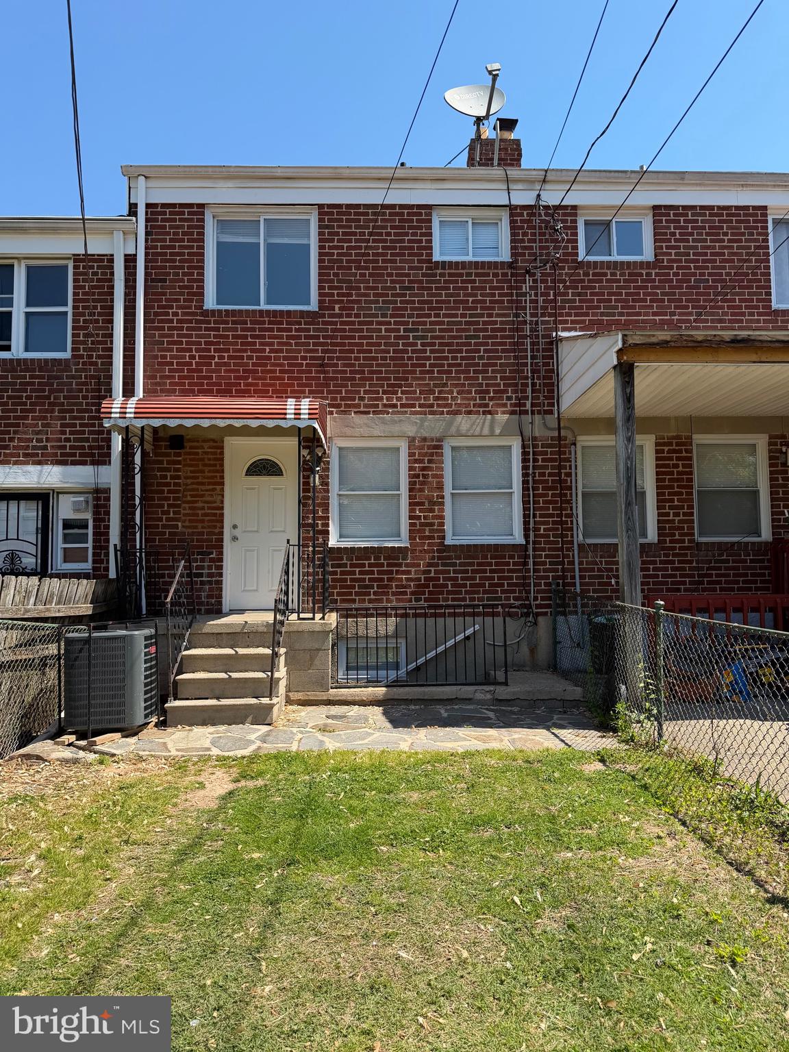 1626 Inverness Avenue Baltimore, MD 21230 - Photo 5 of 19 a front view of a house with a yard