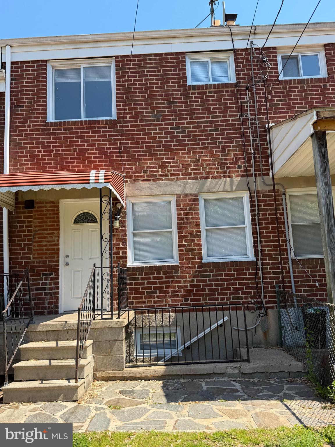 1626 Inverness Avenue Baltimore, MD 21230 - Photo 6 of 19 a view of a brick house with many windows