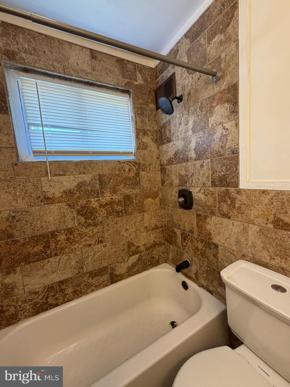 1626 Inverness Avenue Baltimore, MD 21230 - Photo 9 of 19 a bathroom with a toilet and a bathtub