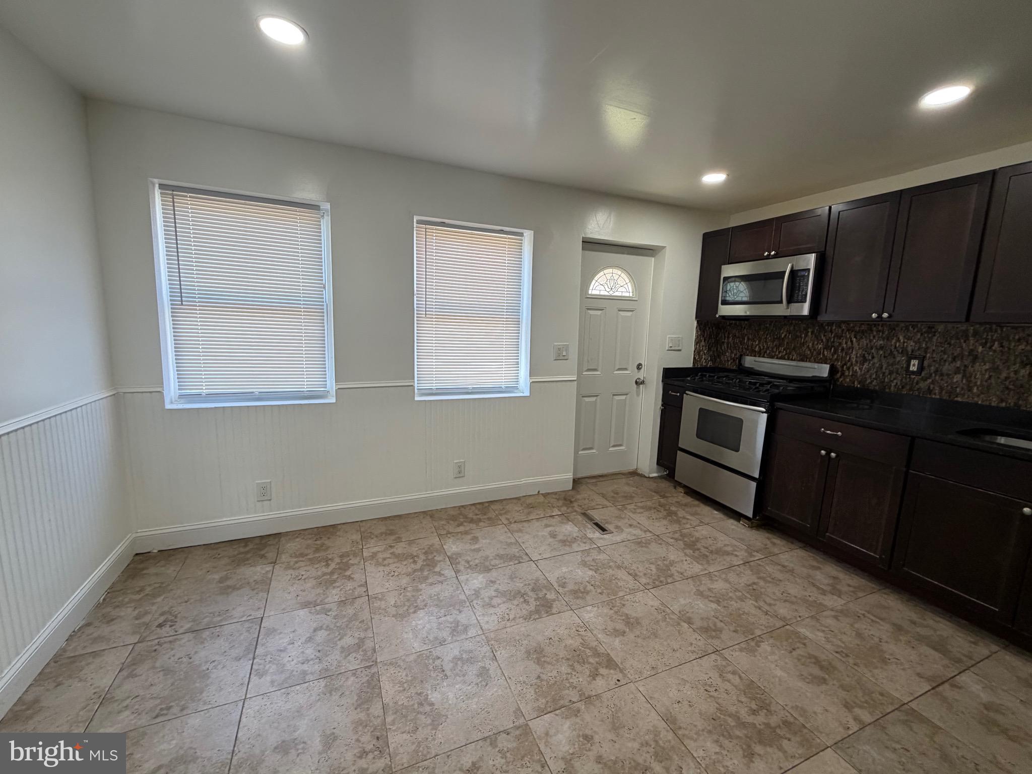 1626 Inverness Avenue Baltimore, MD 21230 - Photo 10 of 19 a view of a kitchen with a sink cabinets and a window