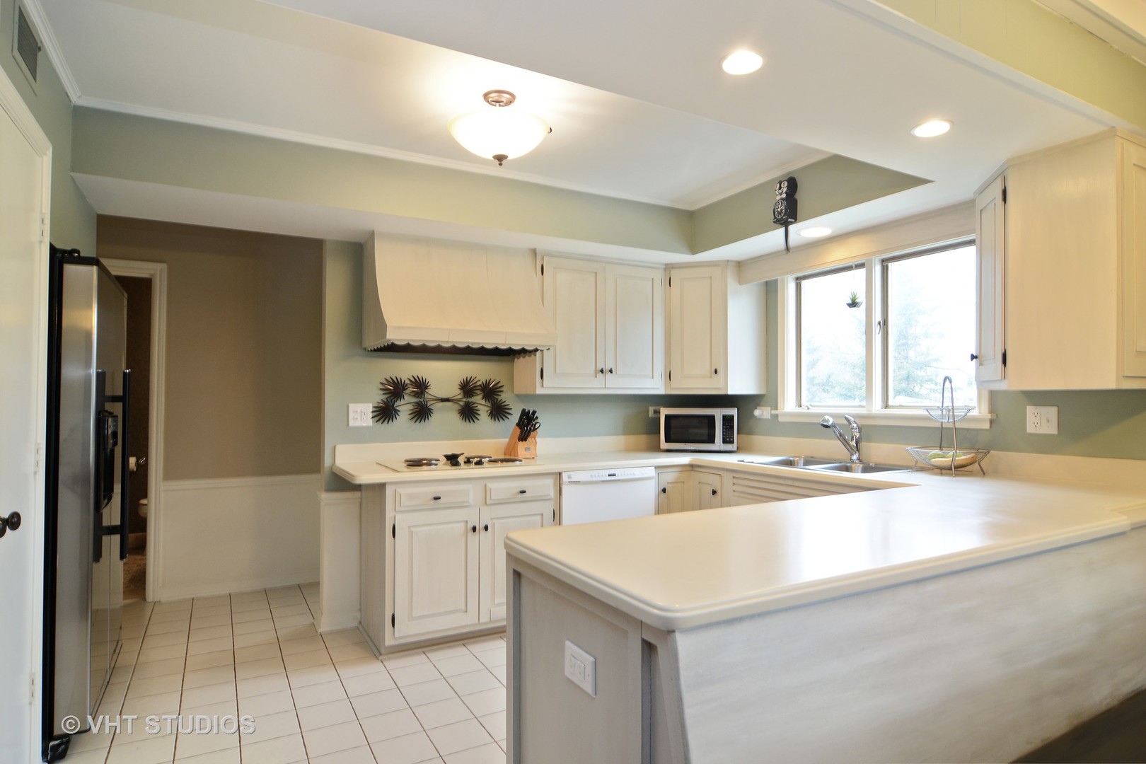 1900 Pheasant Trail Inverness, IL 60067 - Photo 6 of 21 a kitchen with a stove a sink and a refrigerator
