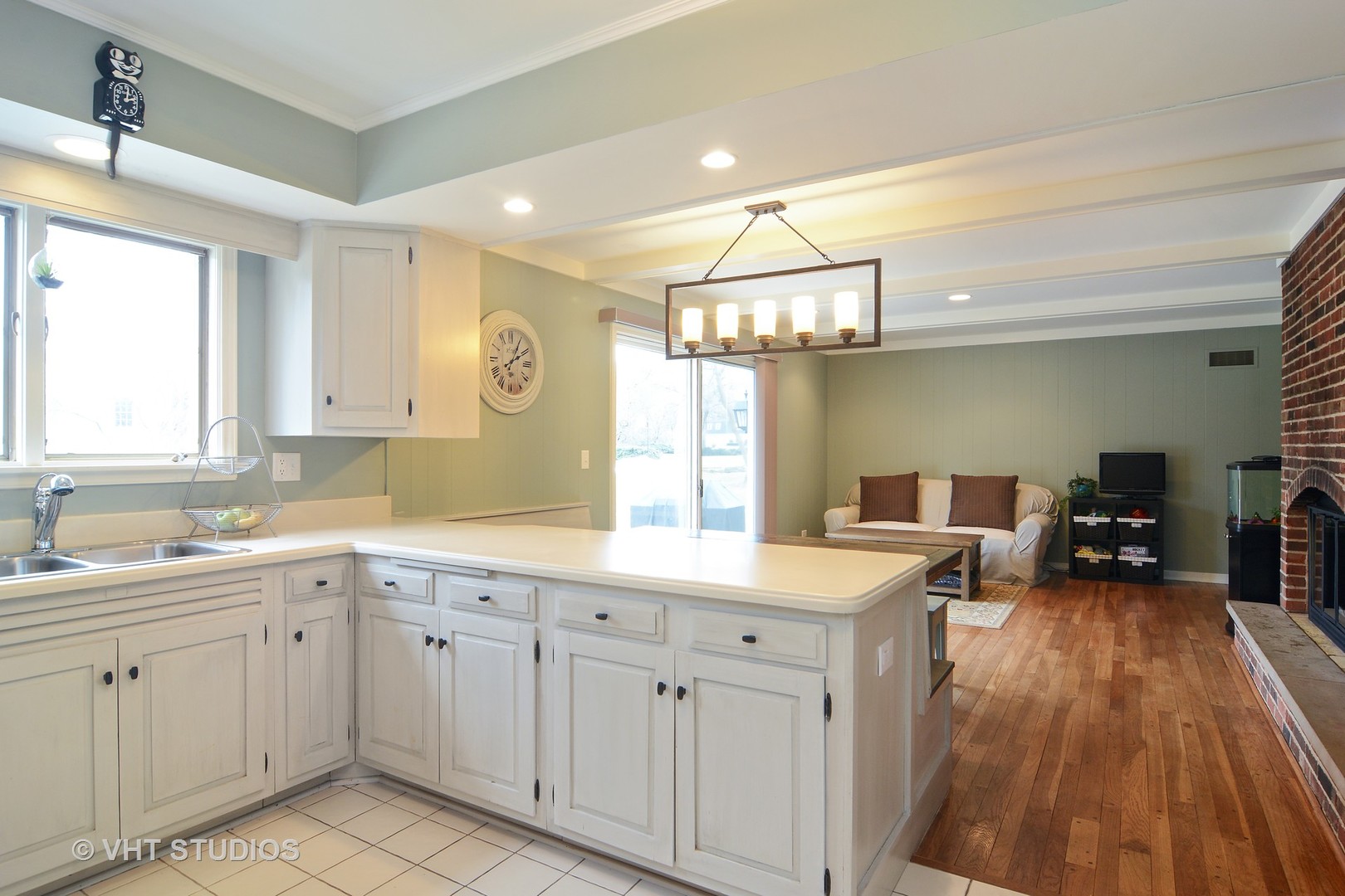 1900 Pheasant Trail Inverness, IL 60067 - Photo 8 of 21 a kitchen with a sink dishwasher a stove a dining table and chairs