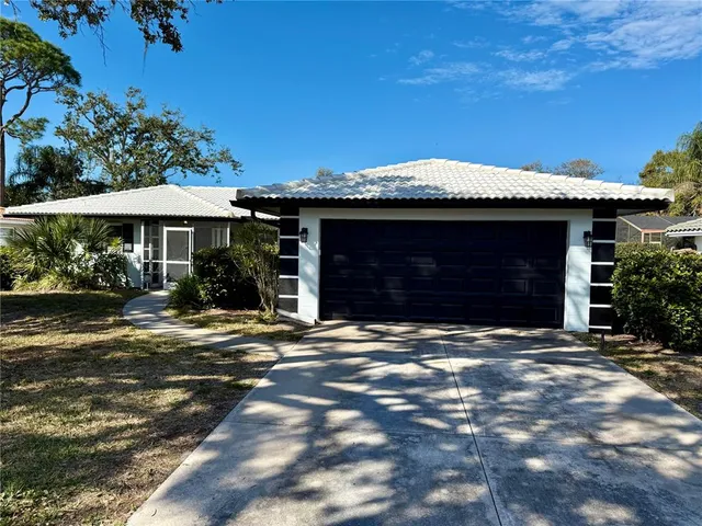 a view of an empty room with a chandelier