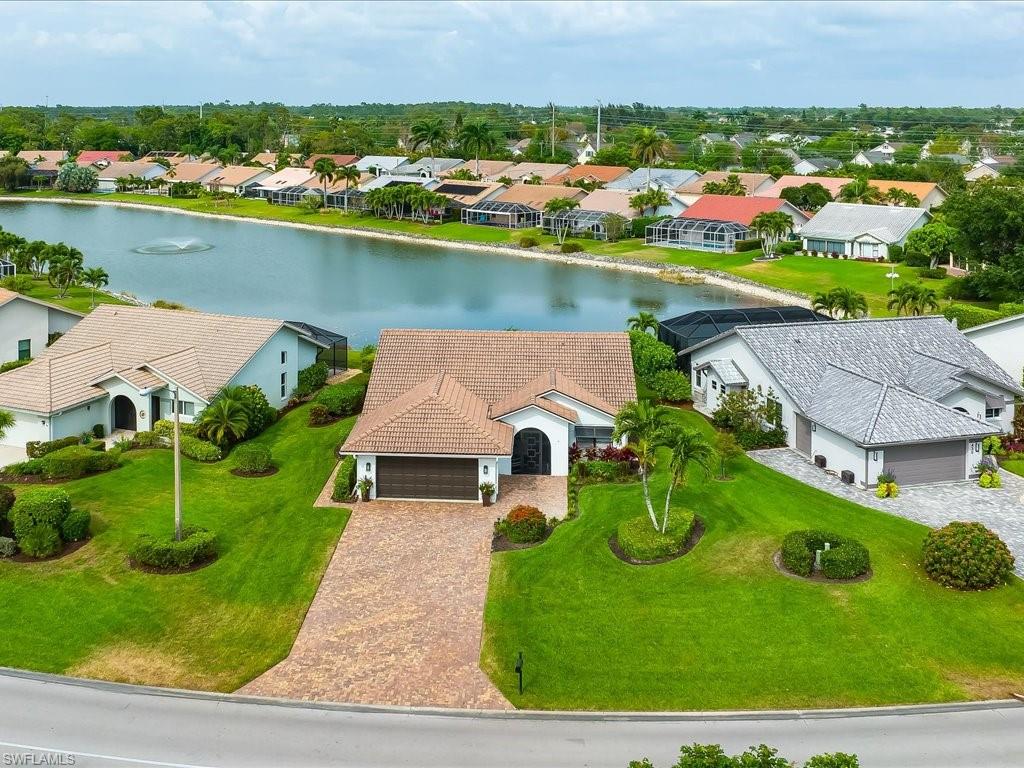 an aerial view of a house with a lake view