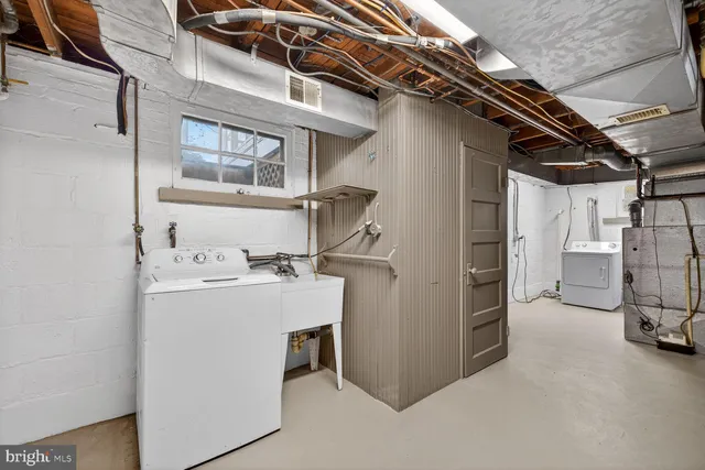 a utility room with dryer and washer