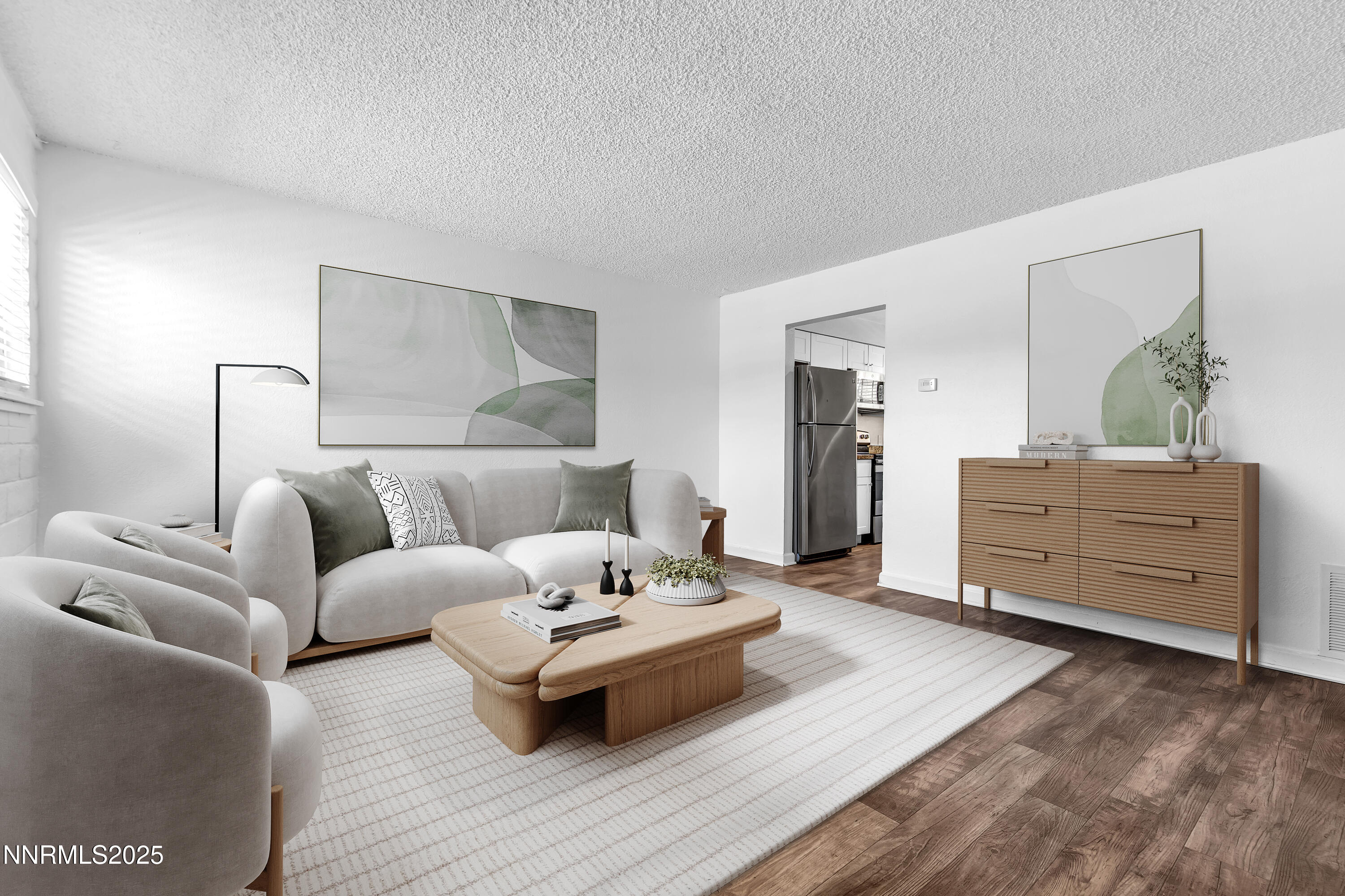 1436 East 9th Street, Unit 8 Reno, NV 89512 - Photo 1 of 19 a living room with furniture and wooden floor