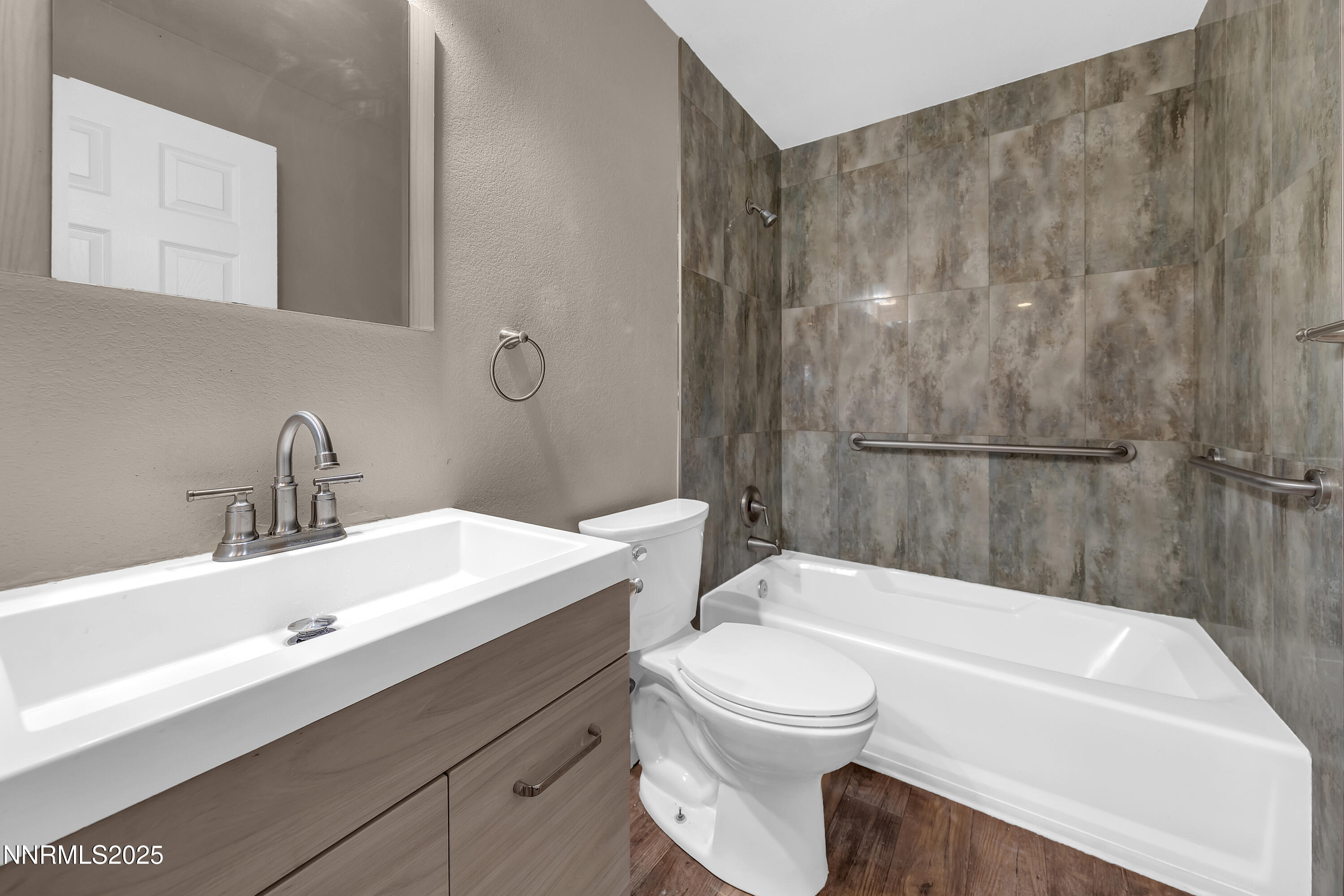 1436 East 9th Street, Unit 8 Reno, NV 89512 - Photo 16 of 19 a bathroom with a sink a toilet and shower
