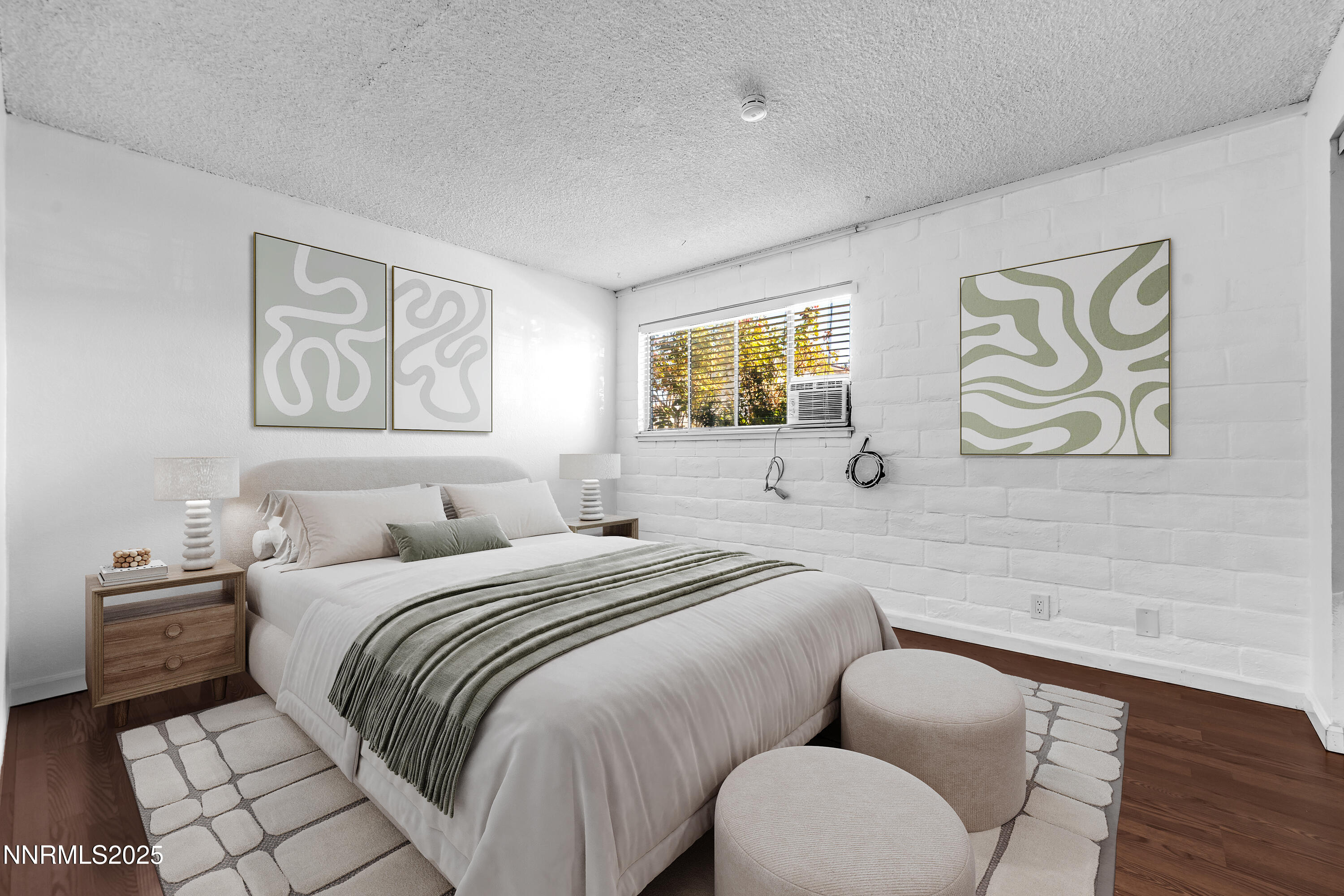 1436 East 9th Street, Unit 8 Reno, NV 89512 - Photo 3 of 19 a bedroom with a bed and a painting on the wall