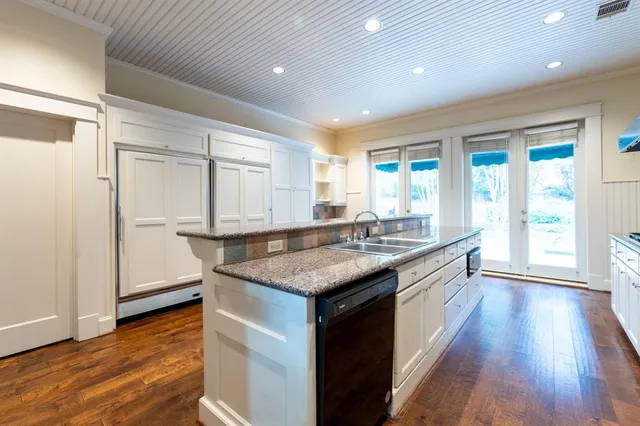 a kitchen with stainless steel appliances granite countertop a stove and a sink