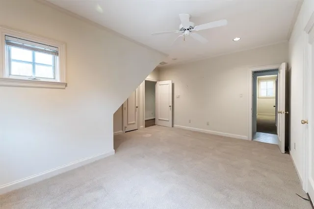 a bathroom with a double vanity sink a toilet a shower and a mirror