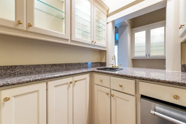 a view of kitchen and hall with wooden floor