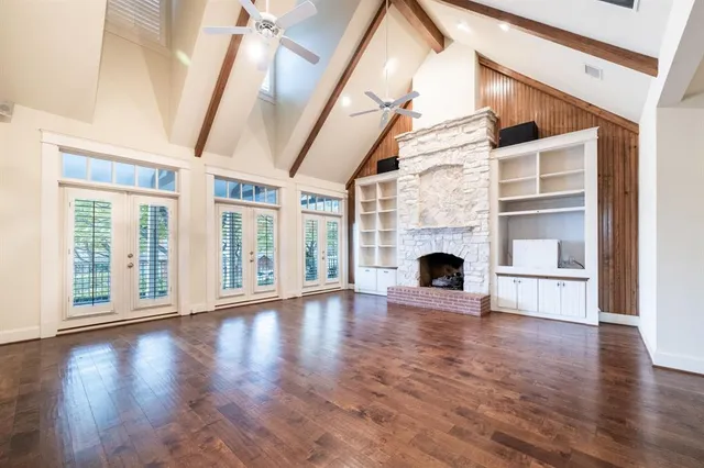 a view of an entryway with wooden floor