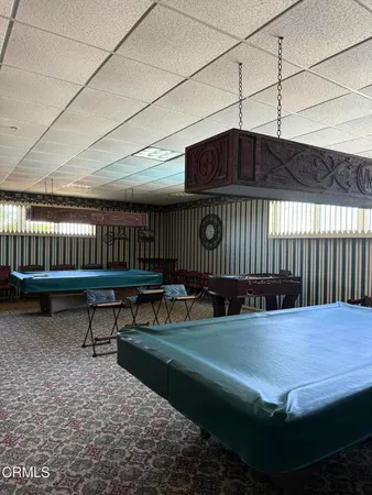 a view of swimming pool with outdoor seating