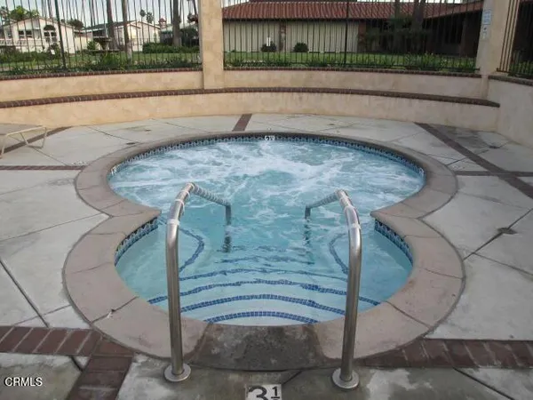 a view of a swimming pool with a porch