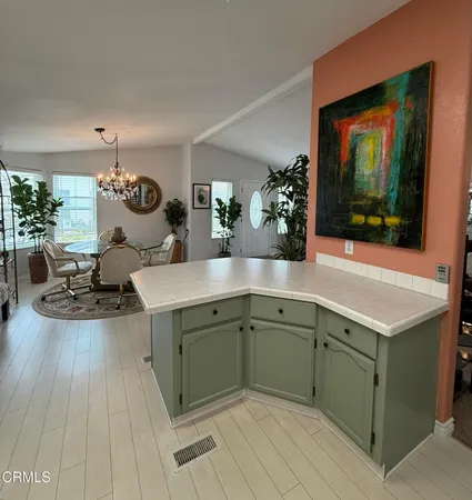 a kitchen with a sink and a stove top oven