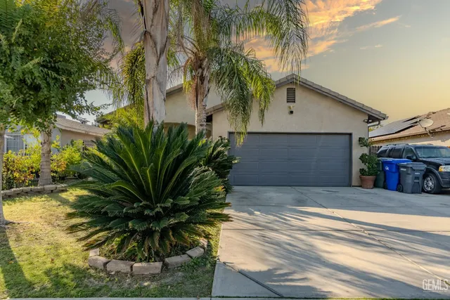 a front view of house with small garden