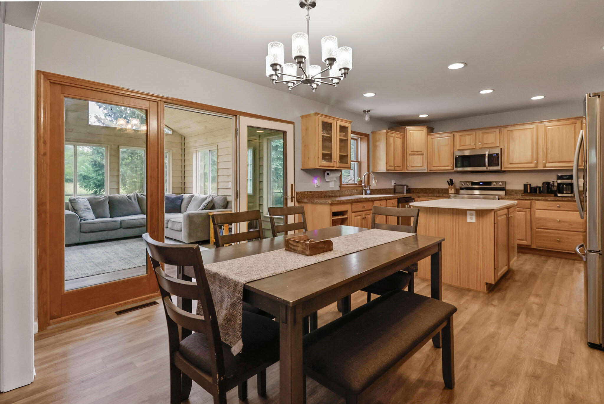 1353 Cobblestone Drive Valparaiso, IN 46385 - Photo 11 of 35 a view of a dining room with furniture window and wooden floor
