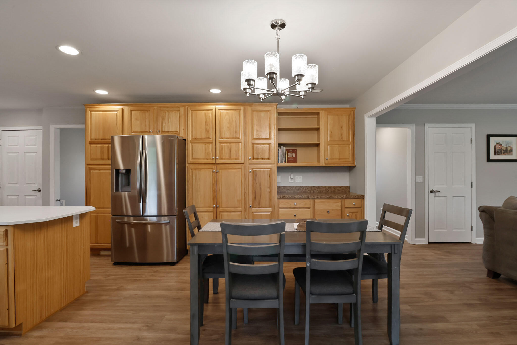 1353 Cobblestone Drive Valparaiso, IN 46385 - Photo 13 of 35 a kitchen with refrigerator and wooden floor