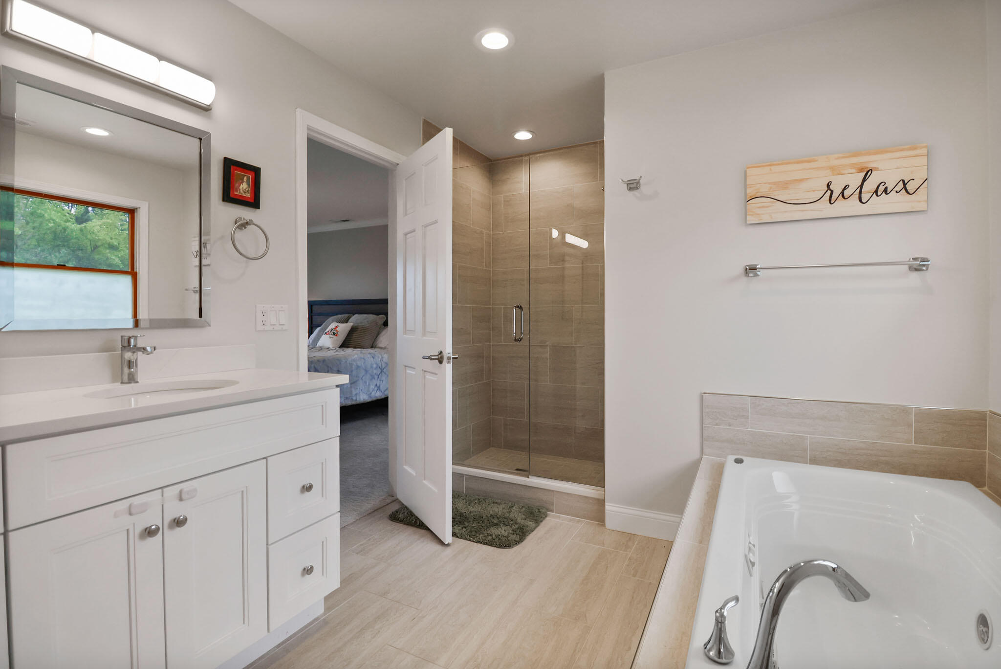 1353 Cobblestone Drive Valparaiso, IN 46385 - Photo 22 of 35 a spacious bathroom with a tub sink a mirror and shower