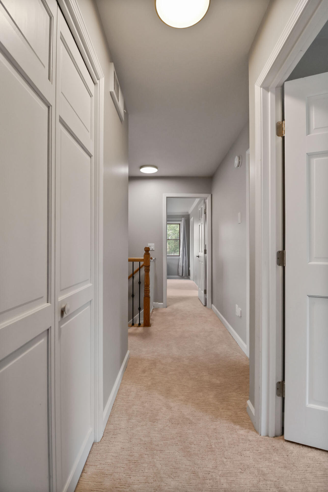 1353 Cobblestone Drive Valparaiso, IN 46385 - Photo 25 of 35 a view of a hallway with wooden shelves