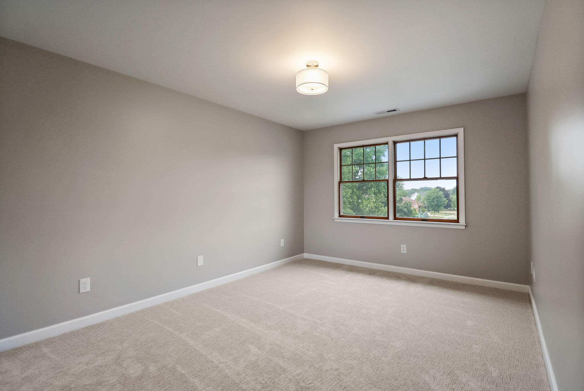 1353 Cobblestone Drive Valparaiso, IN 46385 - Photo 26 of 35 an empty room with windows