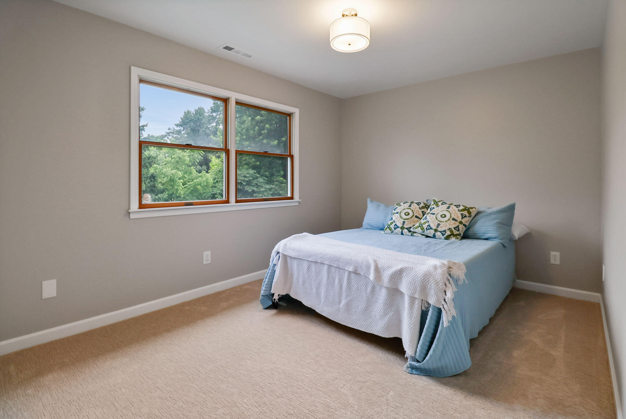 1353 Cobblestone Drive Valparaiso, IN 46385 - Photo 27 of 35 a spacious bedroom with a bed and a window