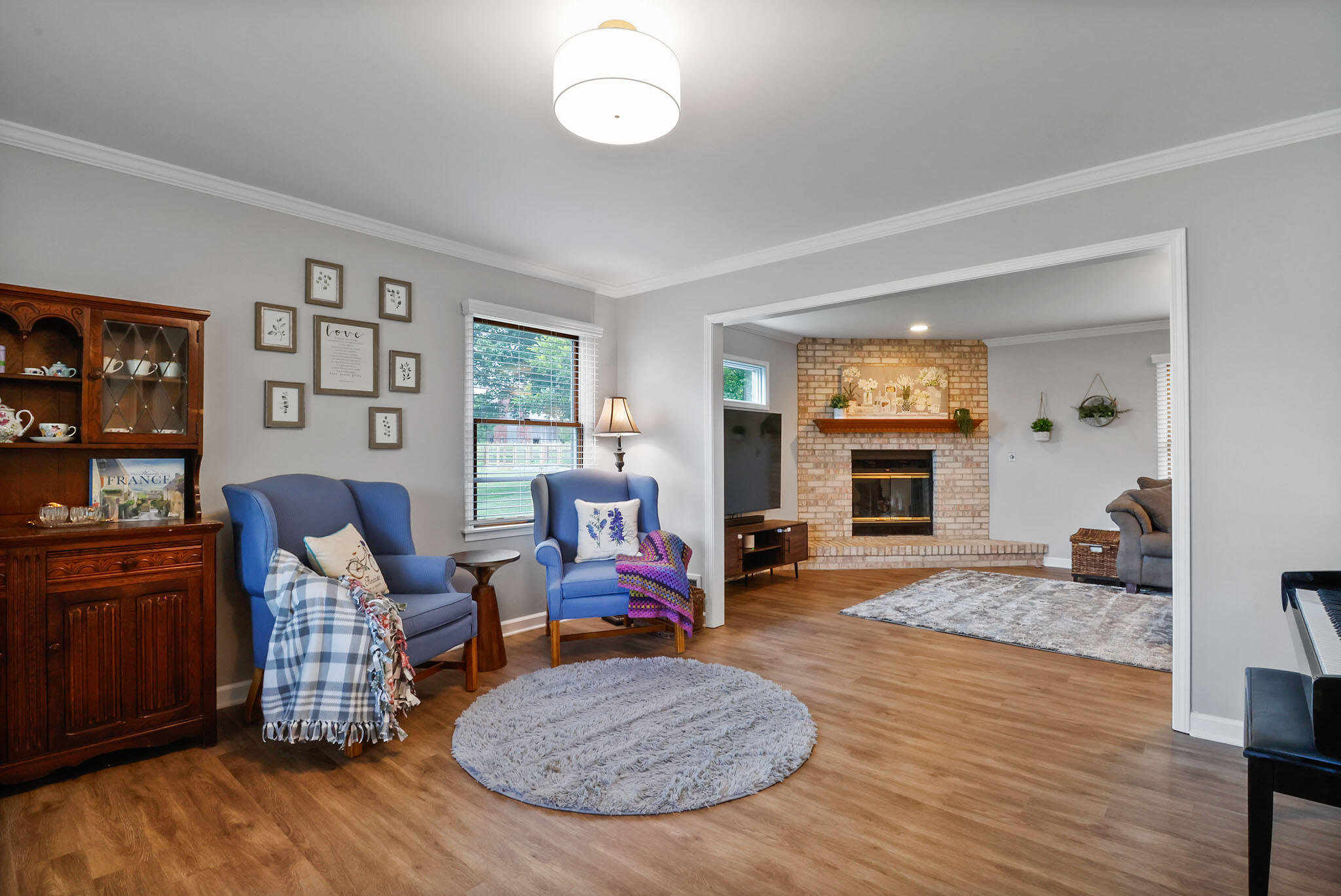 1353 Cobblestone Drive Valparaiso, IN 46385 - Photo 8 of 35 a living room with furniture and a fireplace