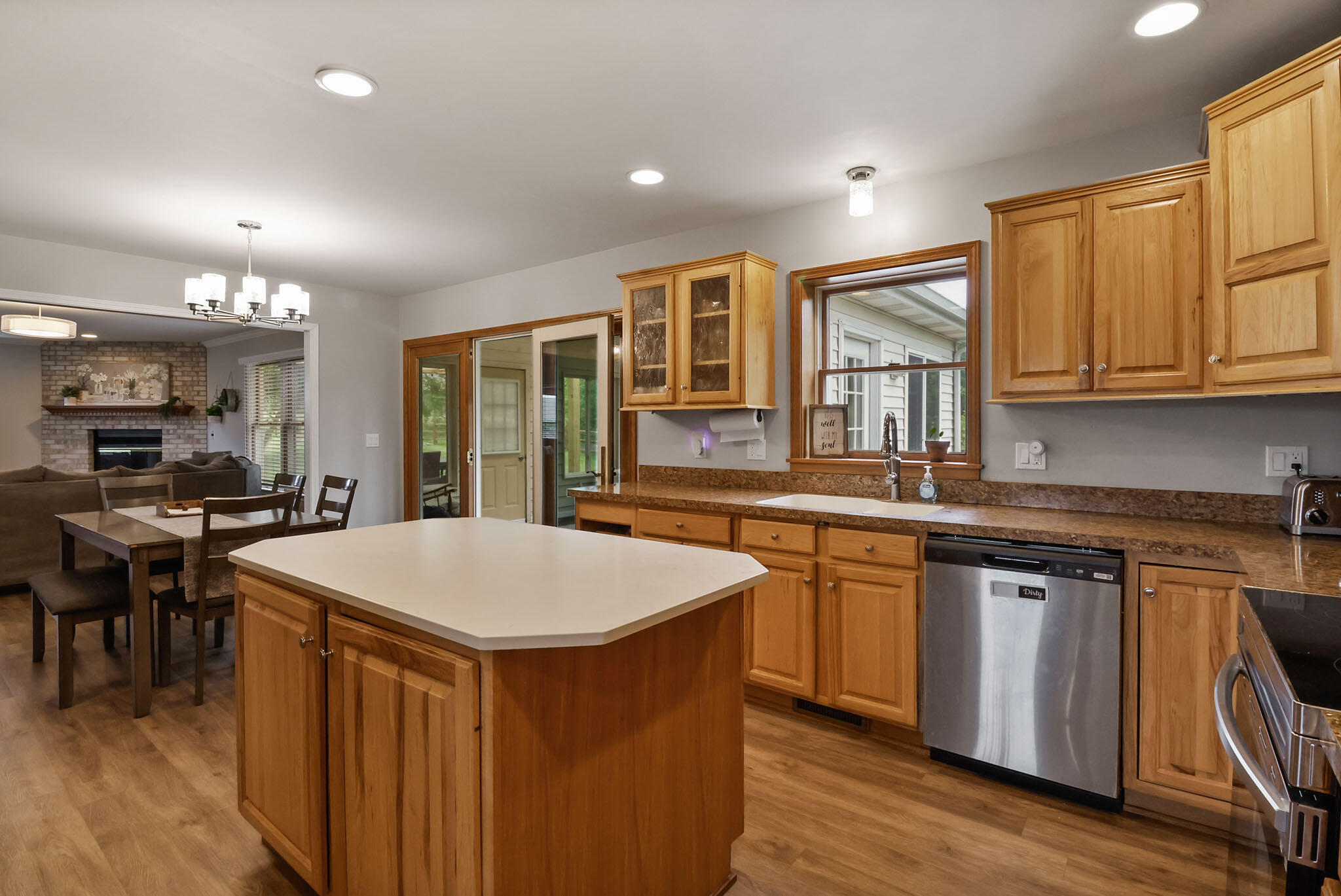 1353 Cobblestone Drive Valparaiso, IN 46385 - Photo 9 of 35 a kitchen with stainless steel appliances granite countertop a stove a sink dishwasher and a refrigerator with wooden floor