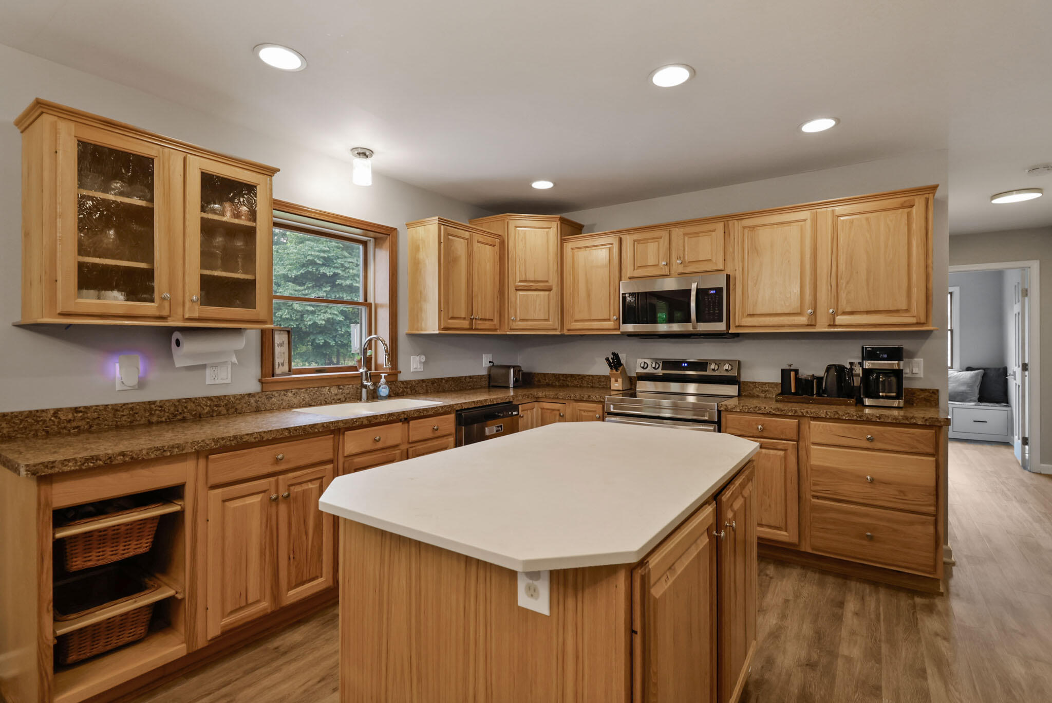 1353 Cobblestone Drive Valparaiso, IN 46385 - Photo 10 of 35 a kitchen with a sink a counter top space stainless steel appliances and cabinets