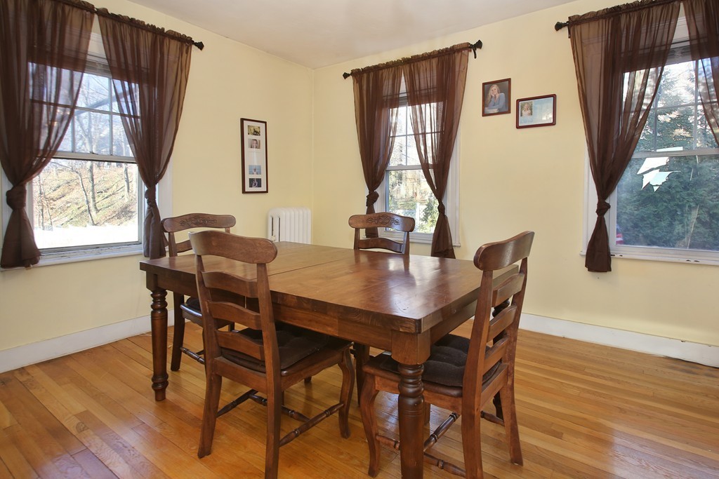 130 Lancaster Terrace Brookline, MA 02446 - Photo 3 of 6 a view of a dining room with furniture and window