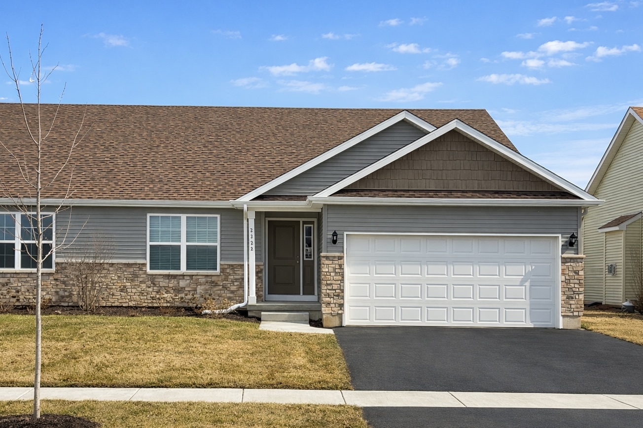 2222 Maggie Lane Sycamore, IL 60178 - Photo 1 of 24 a front view of a house with garden