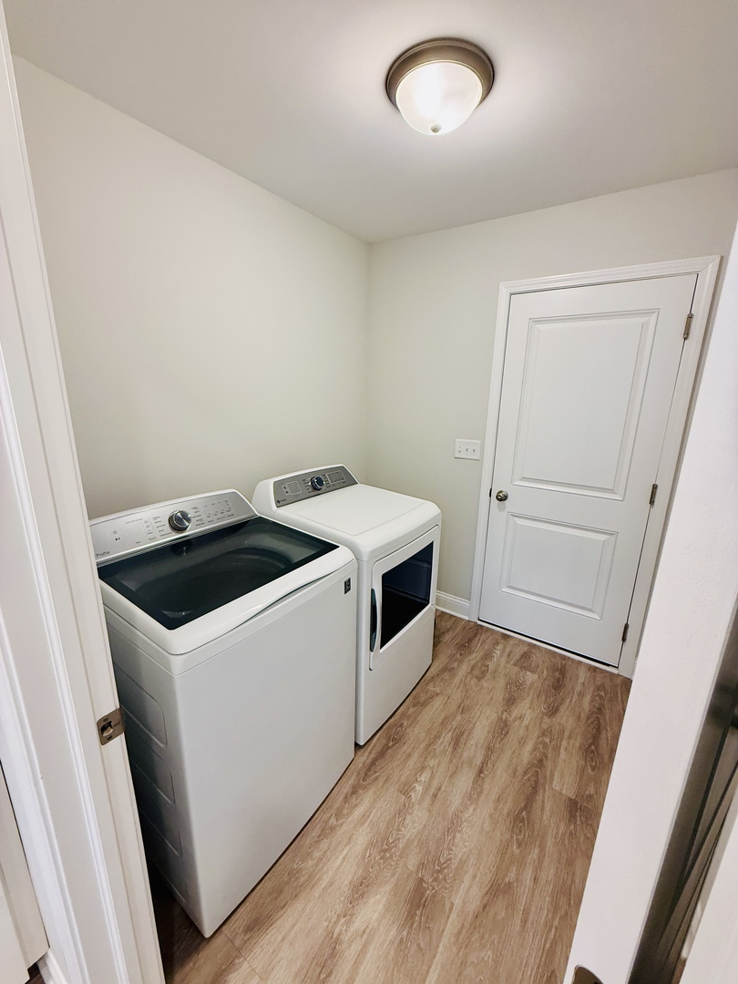2222 Maggie Lane Sycamore, IL 60178 - Photo 11 of 24 a utility room with wooden floor sink and washing machine